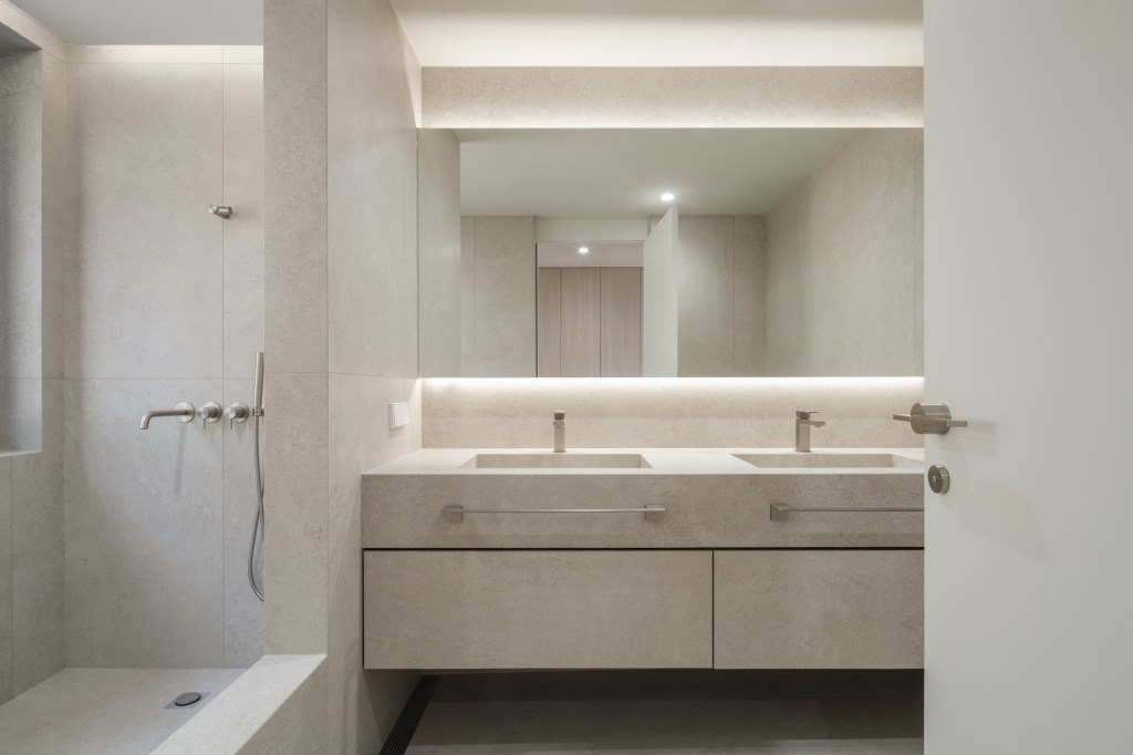 Fully tiled bathroom vanity with large format porcelain tiles