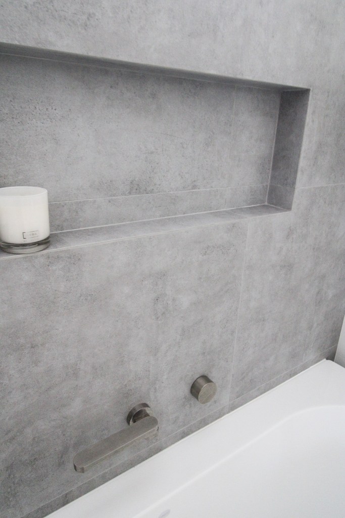 Close up of mitred tile edge in modern bathroom